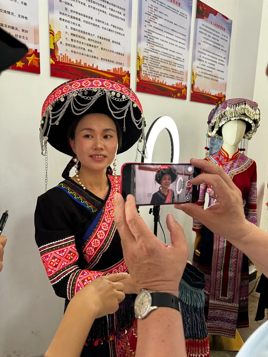 Villagers in Manpeng New Village have embraced livestreaming to increase awareness of local specialties and make sales. (Sim Tze Wei/SPH Media)