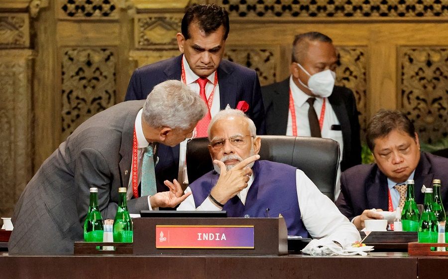 India’s Prime Minister Narendra Modi speaks with Foreign Minister Subrahmanyam Jaishankar at the G20 Leaders’ Summit, in Nusa Dua, Bali, Indonesia, on 16 November 2022.  (Willy Kurniawan/Reuters)