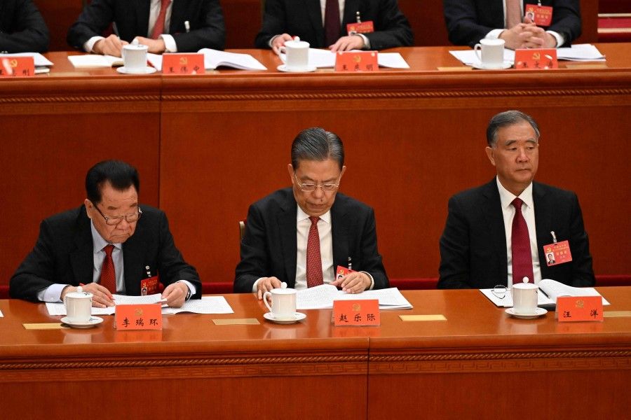 Politburo Standing Committee members Zhao Leji (second from left) and Wang Yang (right) attend the opening session of the 20th Chinese Communist Party's Congress at the Great Hall of the People in Beijing on 16 October 2022. (Noel Celis/AFP)