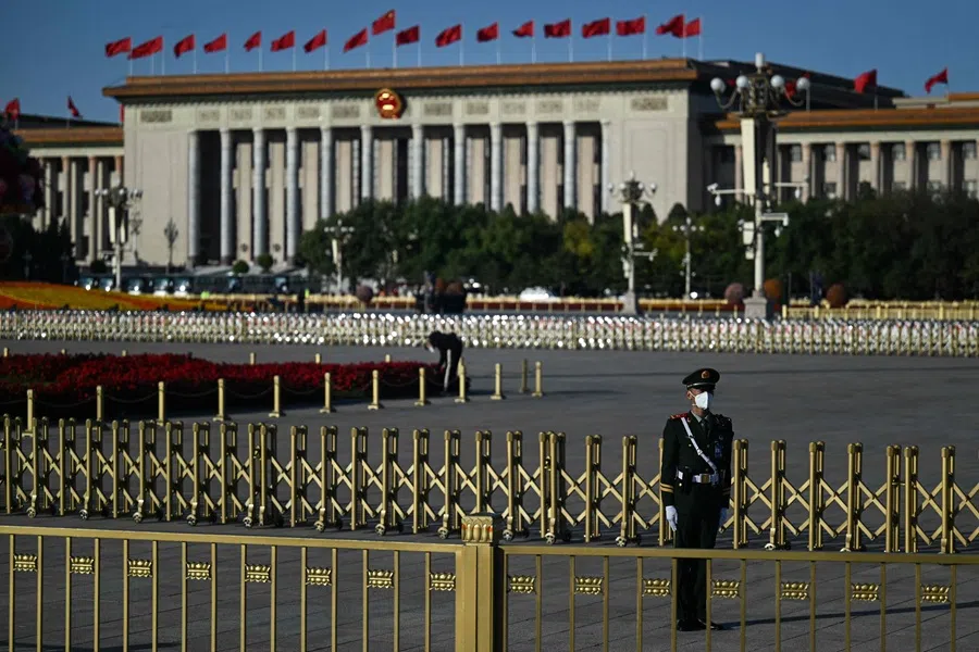 A member of the security staff keeps watch in front of the Great Hall of the People in Beijing on 16 October 2022, ahead of the opening session of the 20th Chinese Communist Party’s Congress. (Noel Celis/AFP)