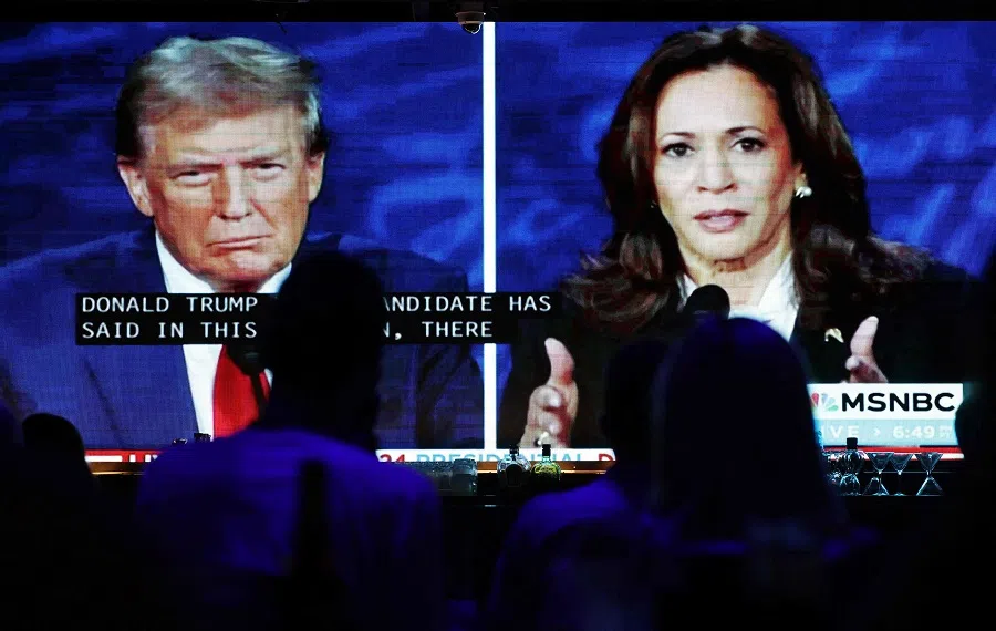 People watch the ABC News presidential debate between Democratic presidential nominee, US Vice President Kamala Harris and Republican presidential nominee, former US President Donald Trump at a debate watch party at The Abbey on 10 September 2024 in West Hollywood, California, US.