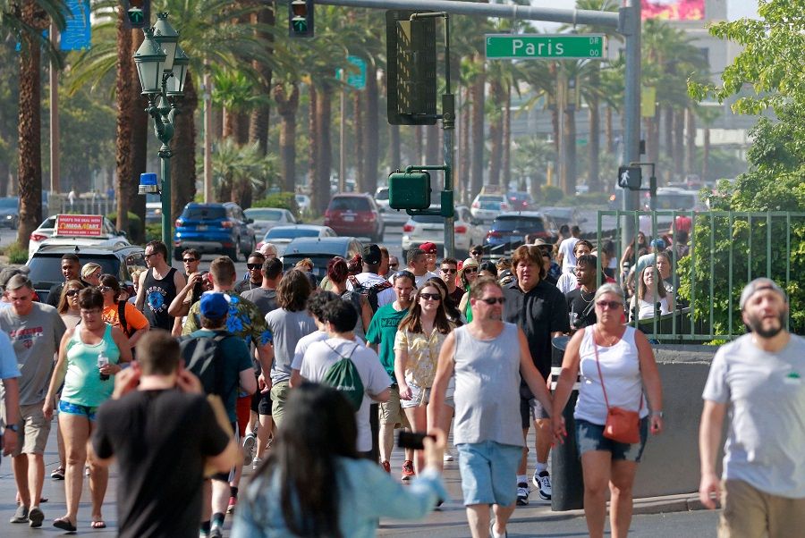 People walk along the Las Vegas Strip, on 16 June 2021, in Las Vegas, Nevada, US. (Ronda Churchill/AFP)