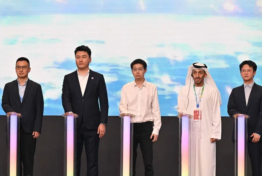 Wang Xingxing (centre), CEO of Unitree, and guests attend the launching of Global Robotics Application Exploration Program during the 2026 World Robot Conference in Beijing, 20 August 2026.