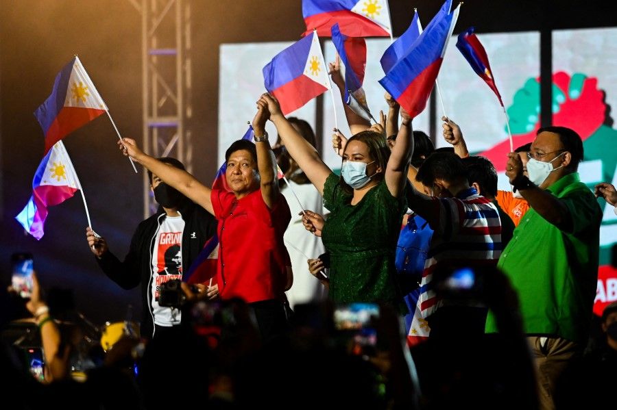 Philippine presidential candidate Ferdinand Marcos Jr, son of late dictator Ferdinand Marcos, and vice-presidential candidate Sara Duterte-Carpio, daughter of Philippine President Rodrigo Duterte, on the campaign trail for the 2022 presidential election, at the Philippine Arena, in Bulacan province, Philippines, 8 February 2022. (Lisa Marie David/Reuters)
