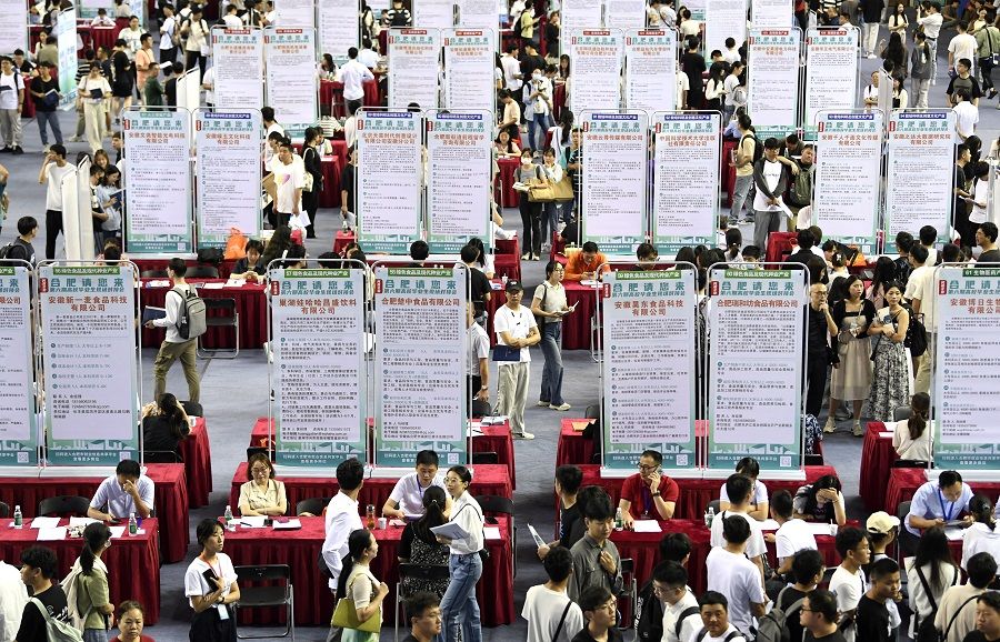 People attend a job fair for university graduates in Hefei, Anhui province, China, on 4 September 2023. (China Daily via Reuters)