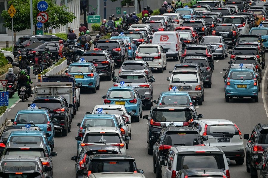 Motorists commute in a traffic jam in Jakarta, Indonesia, on 13 December 2022 (Bay Ismoyo/AFP)