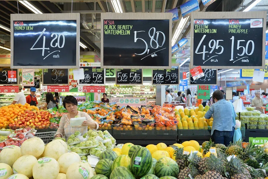 Shoppers at the fruit section at an NTUC Fairprice Xtra supermarket in Singapore. (SPH Media)