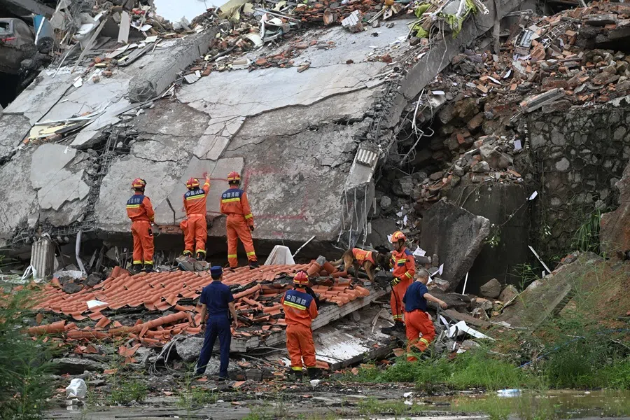 Rescue workers conduct a search and rescue operation at the site of a landslide following heavy rainfall, in Baiyun district of Guangzhou, Guangdong province, China, on 6 August 2025. (CNS photo via Reuters)