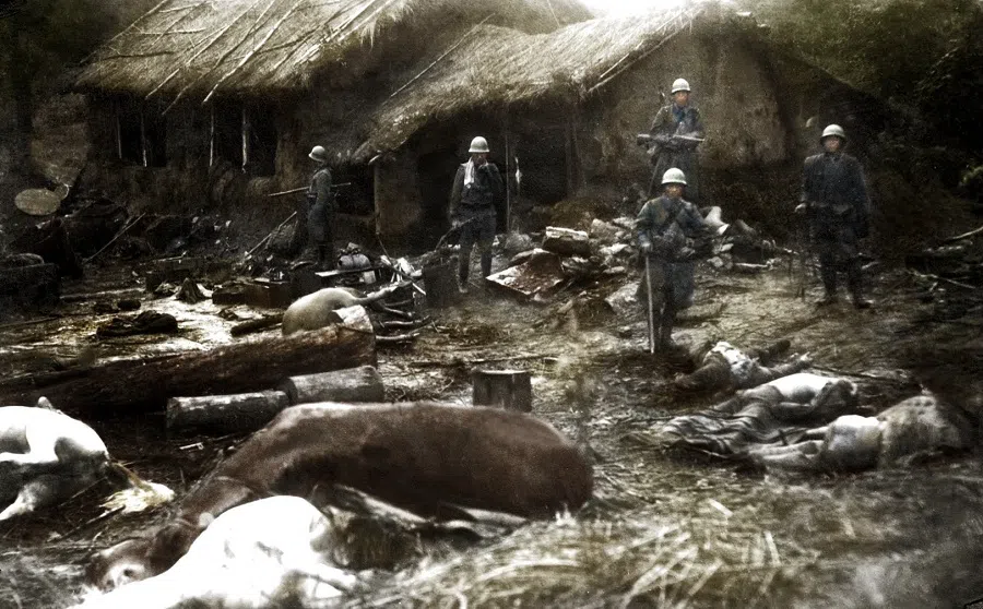 At the end of 1931, Japanese troops entered the villages of Manchuria, with dead civilians and animals on the ground due to bombing.