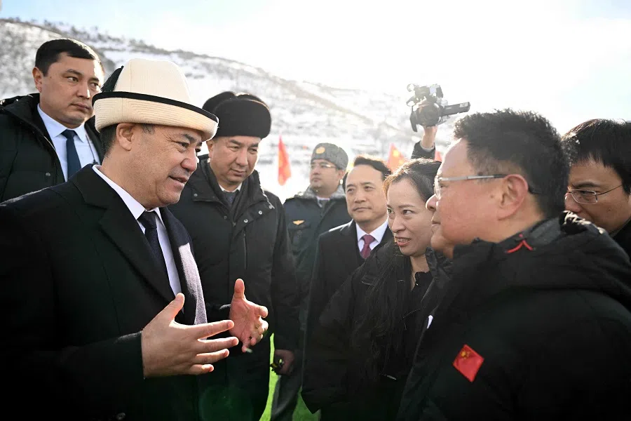 In this handout picture taken and released by the Kyrgyz presidential press office on 27 December 2024, Kyrgyzstan’s President Sadyr Japarov talks to chairman of the National Development and Reform Commission of China Zheng Shanjie during the commencement ceremony of the China-Kyrgyzstan-Uzbekistan railway project in the settlement of Tash-Kitchu. (Handout/Kyrgyz Presidential Press Office/AFP)