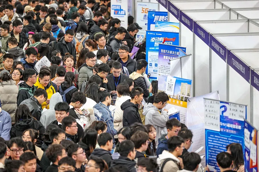 Throngs of people attend a job fair in Shenyang, in northeastern China’s Liaoning province on 22 October 2024. (AFP)