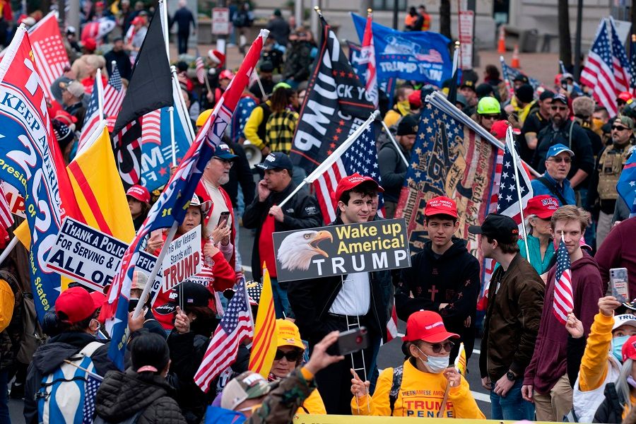 Supporters of US President Donald Trump rally at Freedom Plaza in Washington, DC, on 12 December 2020, to protest the 2020 election. (Jose Luis Magana/AFP)