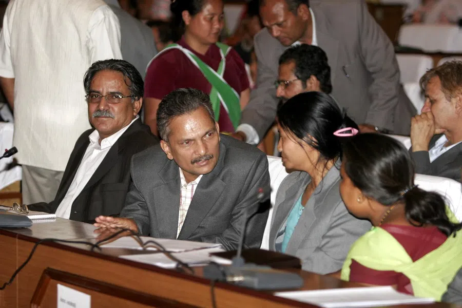Chairman of the Maoist Centre Prachanda (left) and Deputy Chairman Baburam Bhattarai (second from left) talks with members of the Nepali Constituent Assembly (CA) during the meeting at the International Conference Centre (ICC) in Kathmandu, Nepal, 28 May 2008. The first meeting of CA declared the country a federal democratic republic. (Xinhua)