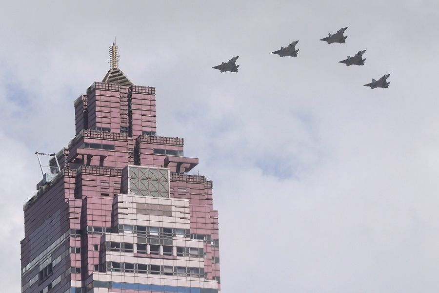 A formation of military airplanes fly during the Double Tenth Day celebration in Taipei on 10 October 2021. (Ann Wang/Reuters)