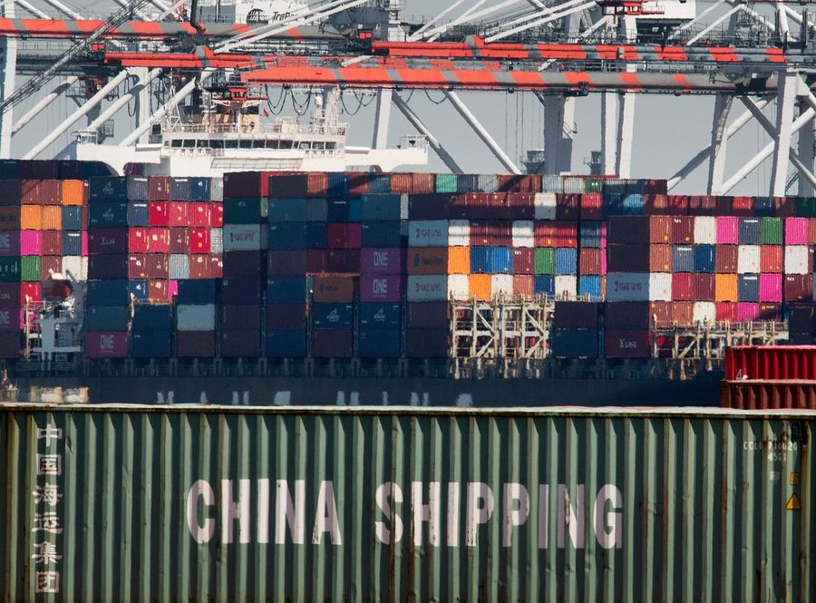 The US did not completely remove tariffs imposed on Chinese products. This file photo shows shipping containers from China and other Asian countries being unloaded at the Port of Los Angeles. (Mark Ralston/AFP)