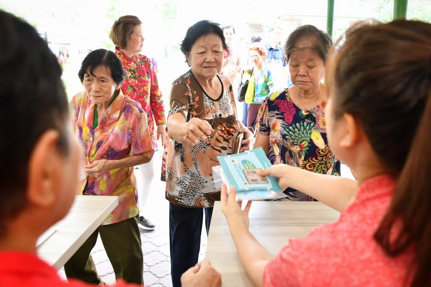 Each household will be receive a pack of four masks from the government. Residents are seen collecting their masks at the Kampong Glam Beach Road Residents' Committee centre, on 1 February 2020. (SPH)