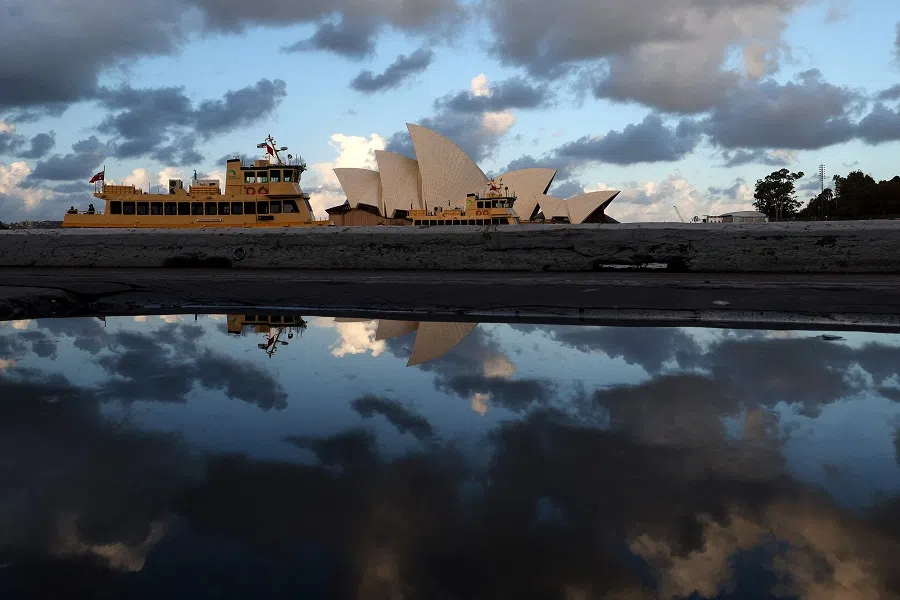 Passenger ferries cruise past the iconic Sydney Opera House as they return tourists to Circular Quayon in Sydney on 23 April 2025.