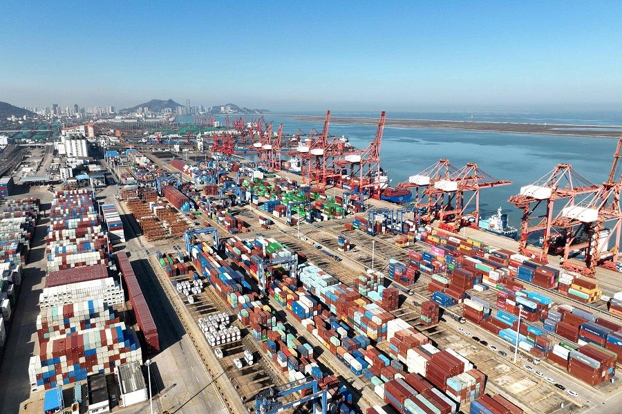 This aerial photo taken on 7 November 2023 shows cranes and shipping containers at Lianyungang port in China's eastern Jiangsu province. (AFP)