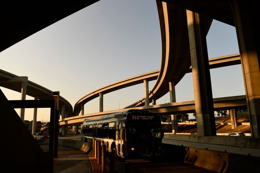 In this file photo taken on 16 July 2021, a Metro Silver Line bus drives on the 110 Freeway under the Judge Harry Pregerson Interchange with the 105 Freeway in Los Angeles, California. (Patrick T. Fallon/AFP)