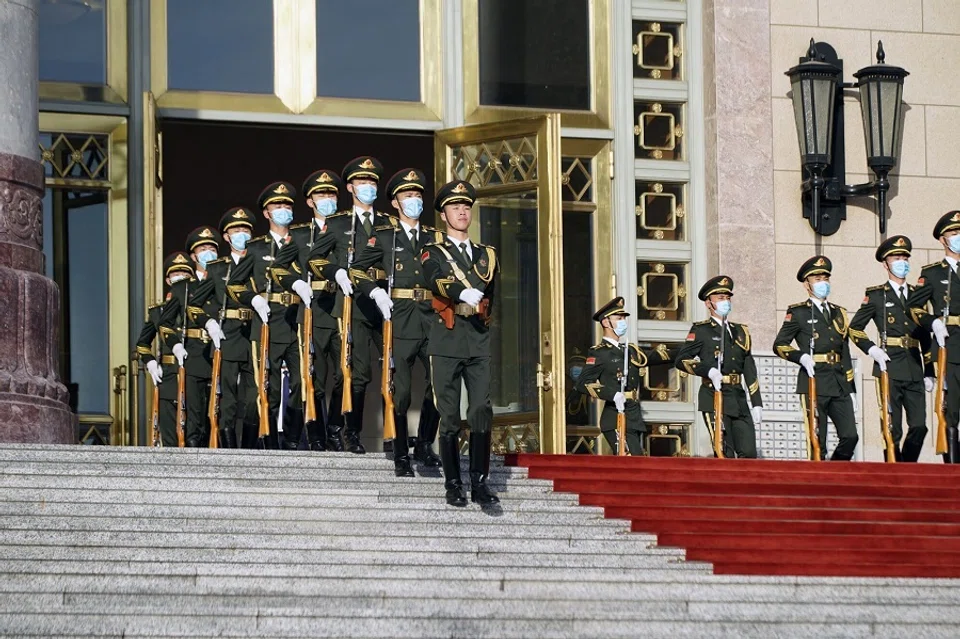 Members of the People's Liberation Army (PLA) march outside the Great Hall of the People on 18 October 2023. (Qilai Shen/Bloomberg)