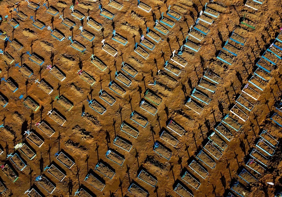 This aerial file photo taken on 21 June 2020 shows graves in the Nossa Senhora Aparecida cemetery in Manaus, Brazil. (Michael Dantas/AFP)