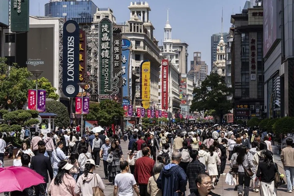Visitors in the Nanjing East Road retail area in Shanghai, China, on 1 May 2026. (Qilai Shen/Bloomberg)