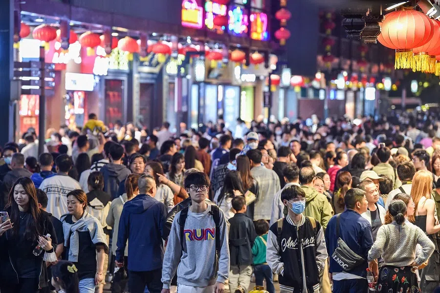 This photo taken on 27 April 2023 shows people visiting Fuzimiao in Nanjing, Jiangsu province, China. (AFP)