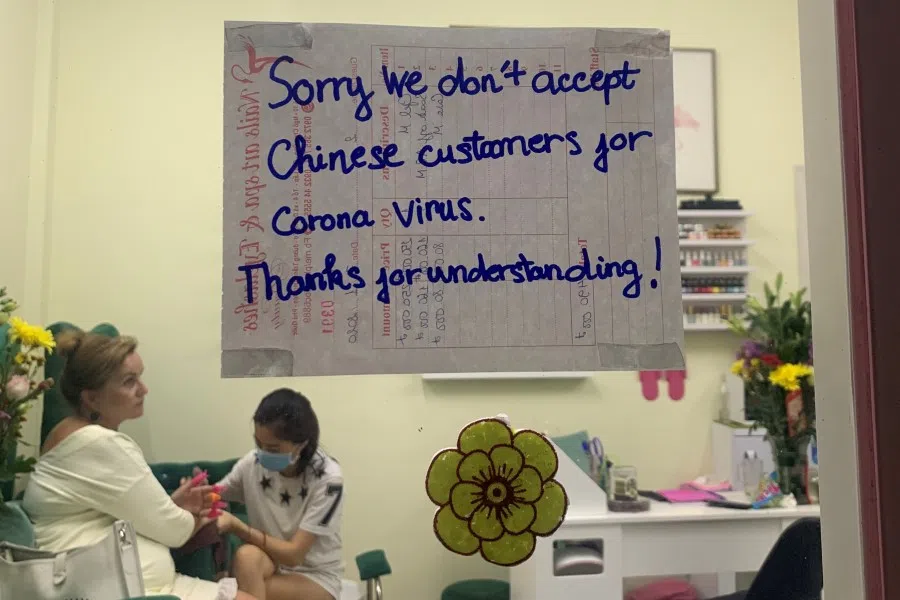 A sign on the front door of a nail bar in the island of Phu Quoc, Vietnam, January 27, 2020. (Sophie Carsten/Reuters)