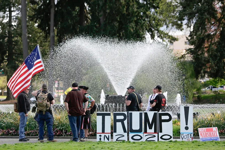 People take part in a demonstration against Washington state's stay-home order at the state capitol in Olympia, Washington, on 19 April 2020. (Jason Redmond/AFP)