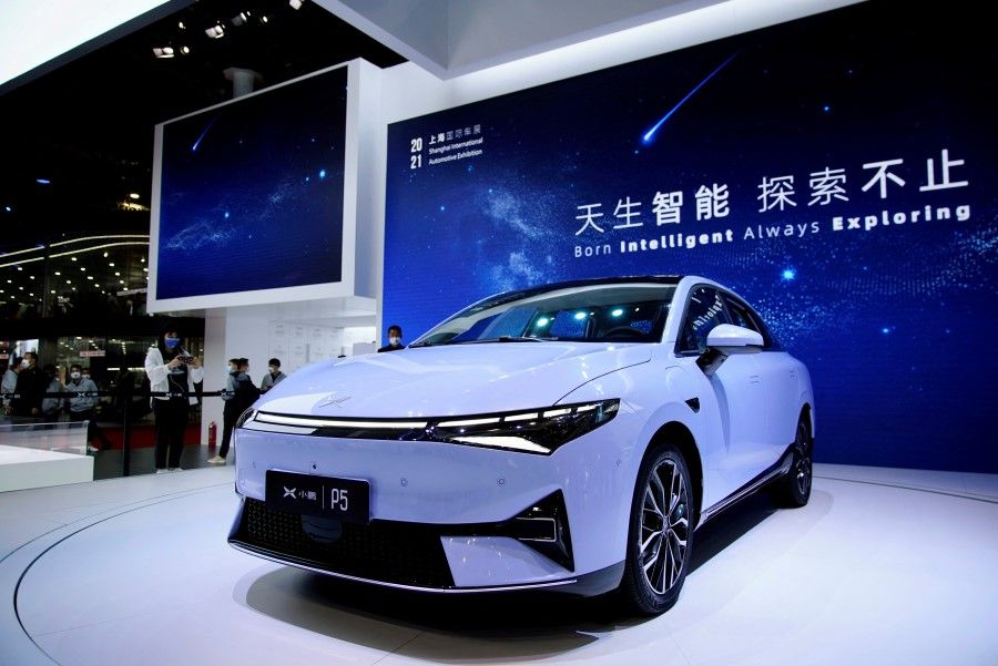 An Xpeng P5 electric vehicle (EV) is seen displayed during a media day for the Auto Shanghai show in Shanghai, China, 19 April 2021. (Aly Song/Reuters)