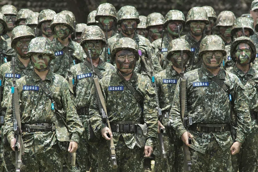 Taiwanese conscripts look on during a visit by Taiwan President Lai Ching-te to a military base in Taichung on 28 June 2024. (Sam Yeh/AFP)