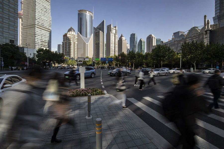 Pedestrians in the Pudong's Lujiazui Financial District in Shanghai, China, on 10 October 2022. (Qilai Shen/Bloomberg)