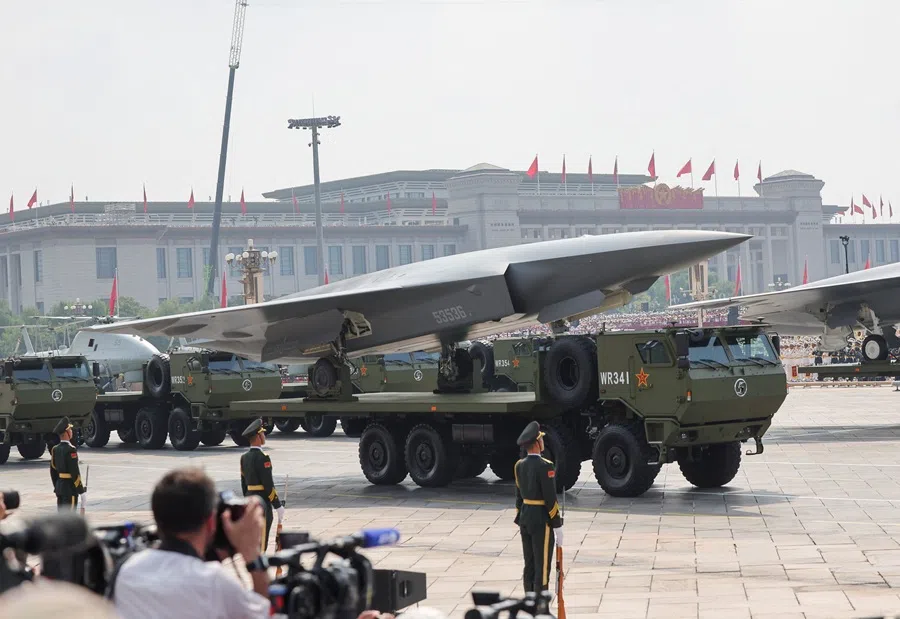 Members of the People’s Liberation Army stand as an unmanned aerial drone passes by during a military parade to mark the 80th anniversary of the end of World War Two, in Beijing, China, on 3 September 2025. (Maxim Shemetov/Reuters)