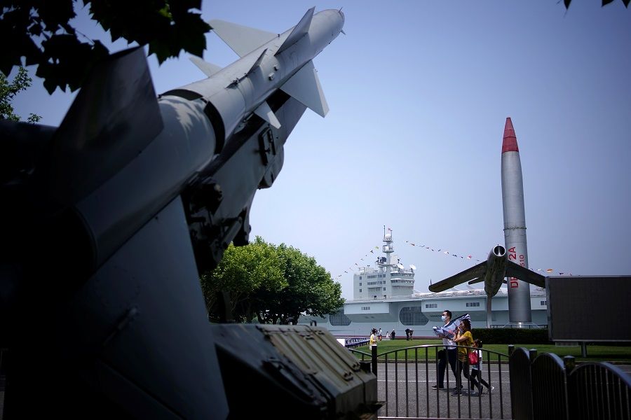 People visit a military theme park following the Covid-19 outbreak in Shanghai, China on 31 May 2020. (Aly Song/Reuters)