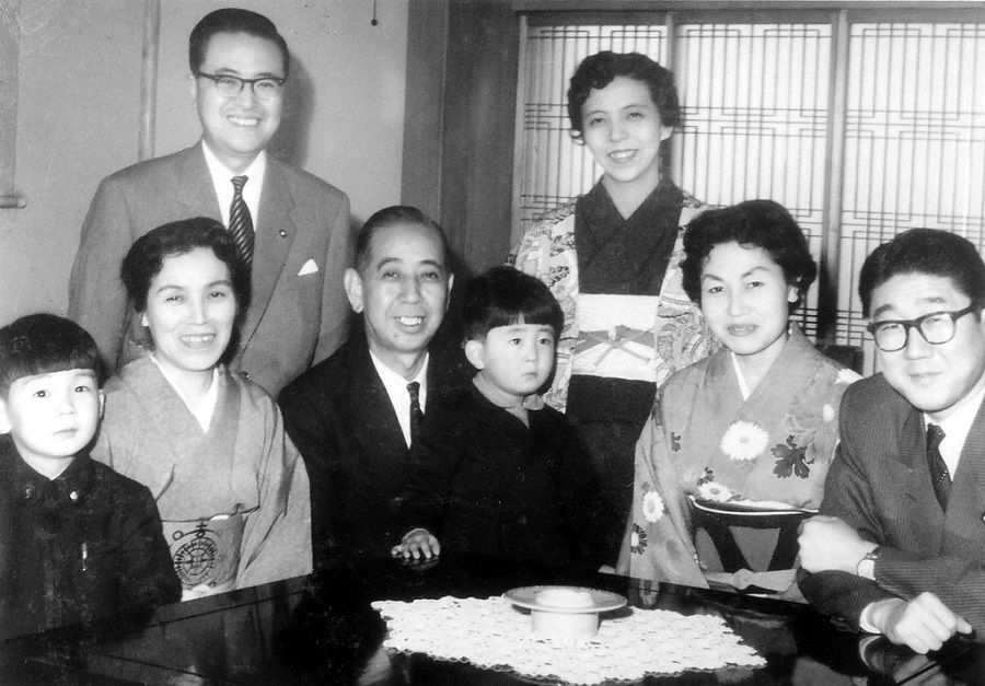 In this undated photo released by the Shinzo Abe Office, Shinzo Abe (front row, third from right) sits on the lap of his grandfather and then Japanese Prime Minister Nobusuke Kishi. (Shinzo Abe Office/Wikimedia)