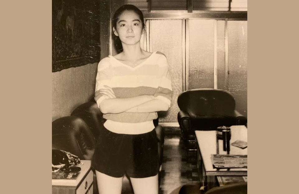 Pictured in my house when I was 19 or 20. The big fat cappuccino sofa is behind me.