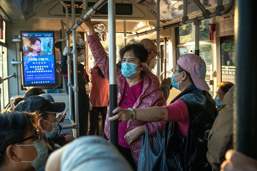Passengers ride a bus in Beijing, China, on 11 October 2022. (Bloomberg)