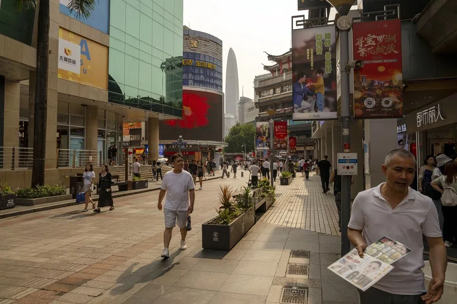Pedestrians in the Dongmen area in Shenzhen, China, on 7 May 2024. (Raul Ariano/Bloomberg)