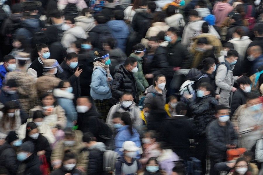 Passengers wait to board trains at Shanghai's Hongqiao Railway Station during the annual Spring Festival travel rush ahead of the Chinese Lunar New Year, as the coronavirus disease (Covid-19) outbreak continues, in Shanghai, China, 18 January 2023. (Aly Song/Reuters)