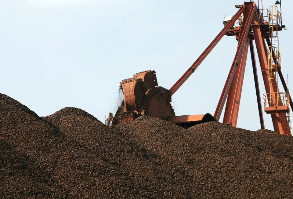 A conveyer belt dumps iron ore into a pile at an iron ore transfer and storage centre operated by the Shanghai International Port Group in Shanghai, China, on 26 January 2010. (Qilai Shen/Bloomberg)