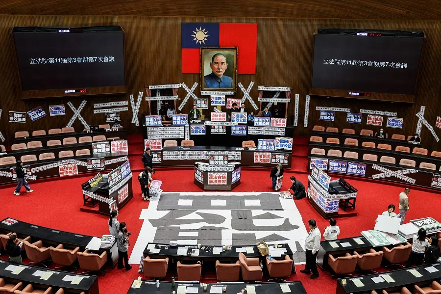 A poster reading “recall” is placed on the floor and banners reading “Illegal meeting, invalid resolution” are plastered throughout the Legislative Yuan in Taipei, Taiwan on 28 March 2025.