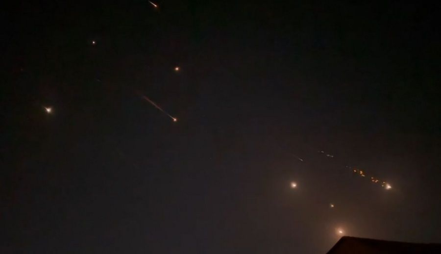 This video grab from AFPTV taken on 14 April 2024 shows explosions lighting up the sky in Hebron, Palestinian Territories, during an Iranian attack on Israel. (AFPTV/AFP)