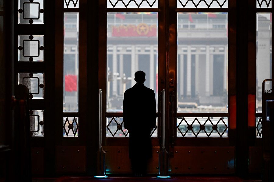 A security guard stands at his post during the opening session of the National People's Congress (NPC) at the Great Hall of the People in Beijing, China, on 5 March 2024. (Wang Zhao/AFP)