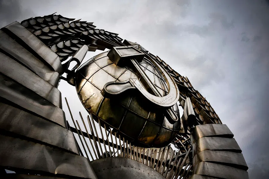 A huge state emblem of the USSR sits in a modern history sculpture park in Moscow on 24 August 2020, where the emblem was placed after the collapse of the Soviet Union in 1991. (Alexander Nemenov/AFP)