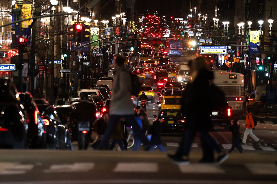 Cars and pedestrians move along Madison Avenue in the Manhattan borough of New York City on 3 February 2025. (Charly Triballeau/AFP)