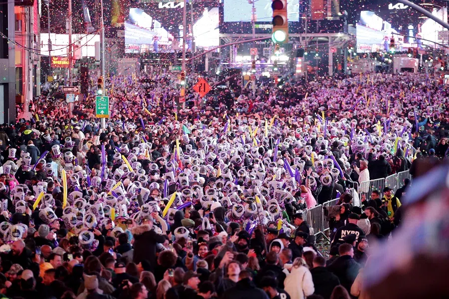Revelers celebrate the New Year at Times Square in New York City, just after midnight on 1 January 2025. (Leonardo Munoz/AFP)