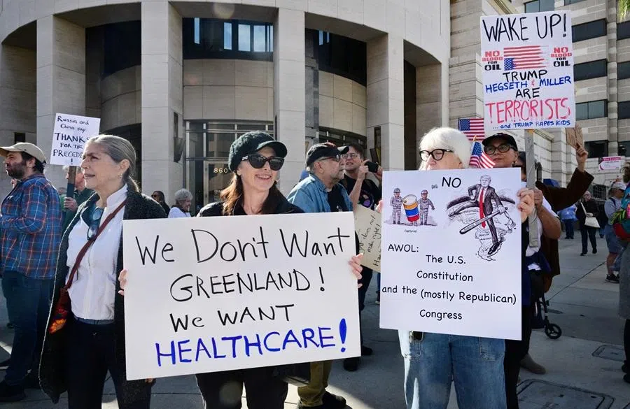 Activists gather to protest against US President Donald Trump's recent action in Venezuela on 6 January 2026 in Pasadena, California, calling on Congress for an immediate end to military action, accountability for President Trump's actions and diplomacy over war. (Frederic J. Brown/AFP)