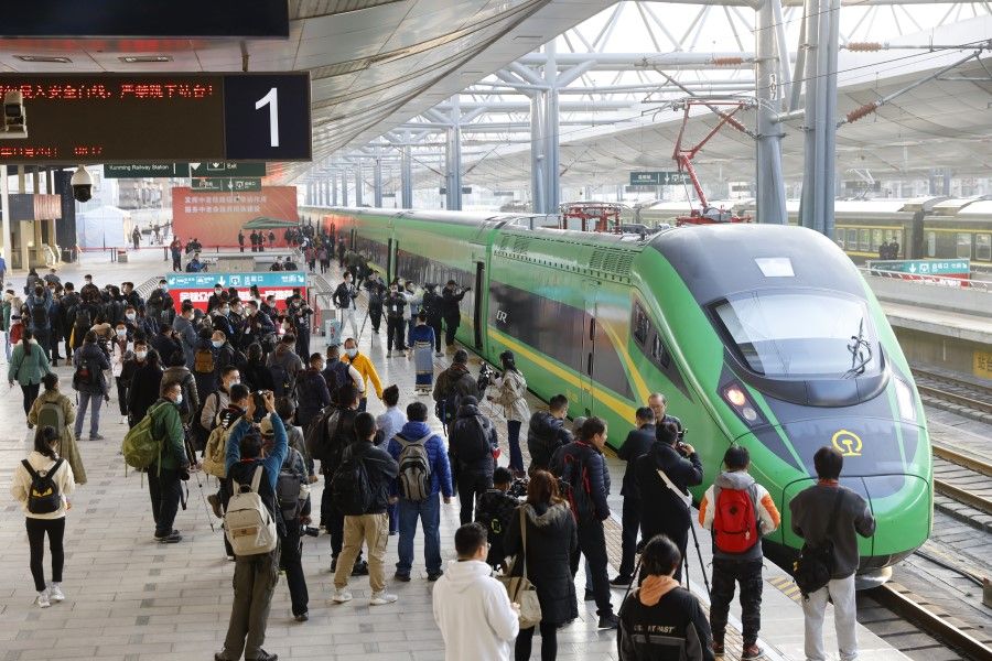 This photo on 26 November 2021 shows journalists gathered at a train station in Kunming to join a preview ride on the China-Laos railway, which is set to start operating in early December 2021. (CNS)