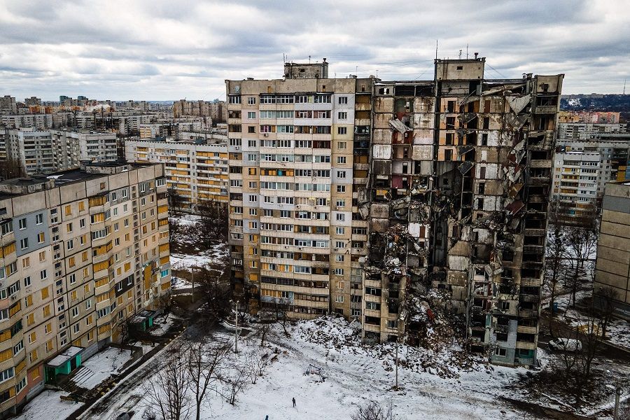 An aerial view shows residential buildings damaged by shelling in the Saltivka district of Kharkiv, Ukraine, on 20 February 2023, amid the Russian invasion of Ukraine. (Ihor Tkachov/AFP)