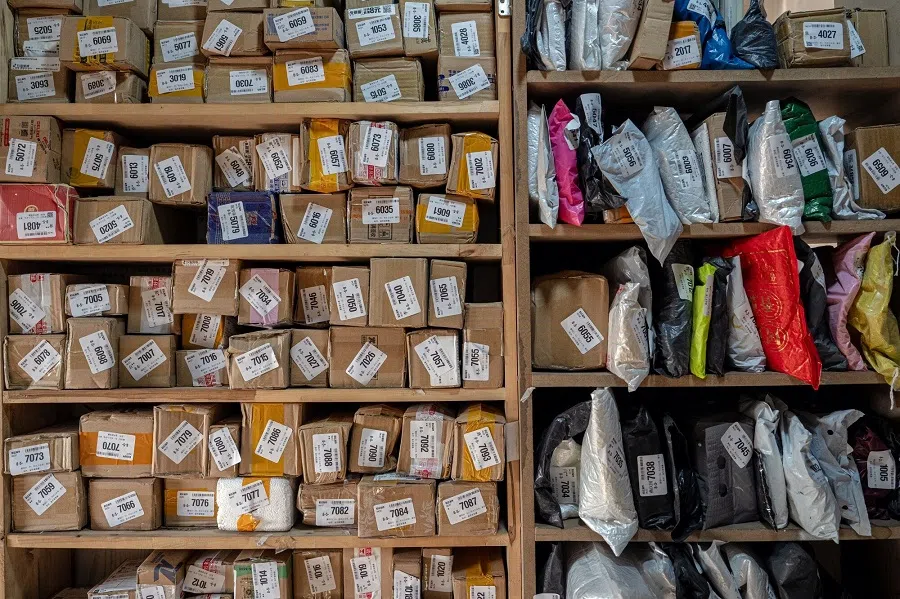 Packages at a neighbourhood sorting centre in Beijing, China, on 28 April 2025. (Na Bian/Bloomberg)